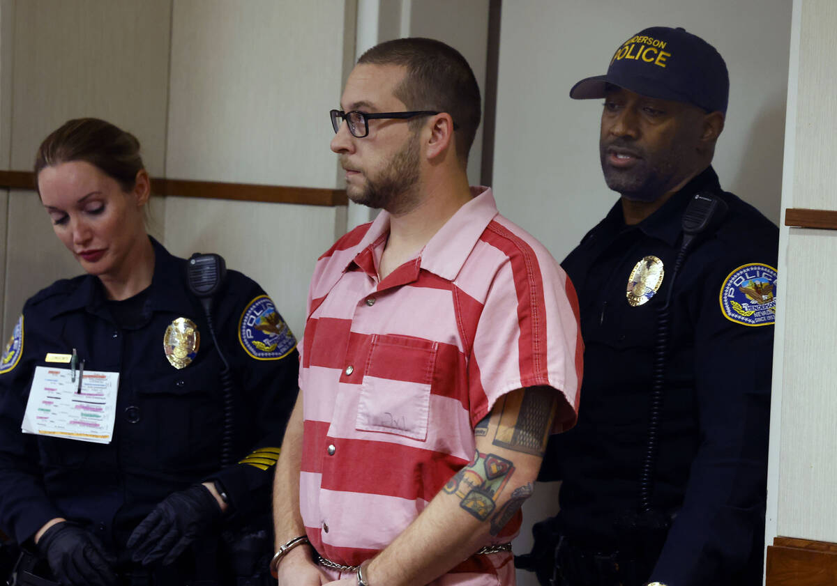 Anthony Coffield, 35, a CCSD teacher charged with sexual assault, is led into a courtroom at He ...