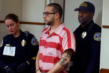 Anthony Coffield, 35, a CCSD teacher charged with sexual assault, is led into a courtroom at He ...