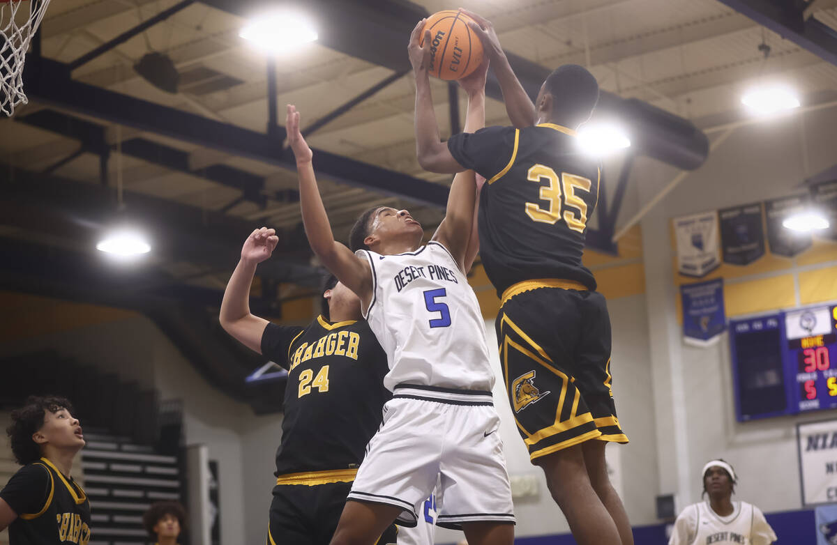 Desert Pines guard/forward Mason Robles (5) and Clark small forward/power forward Devan Christi ...