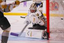 Goaltender Carter Hart warms up before the Silver Knights’ game against the Calgary Wran ...