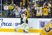 Golden Knights goaltender Carter Hart (79) skates past fans with welcoming signs during the war ...