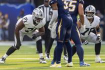 Raiders offensive tackle DJ Glaze (71) and guard Caleb Rogers (76) set up on the line of scrimm ...