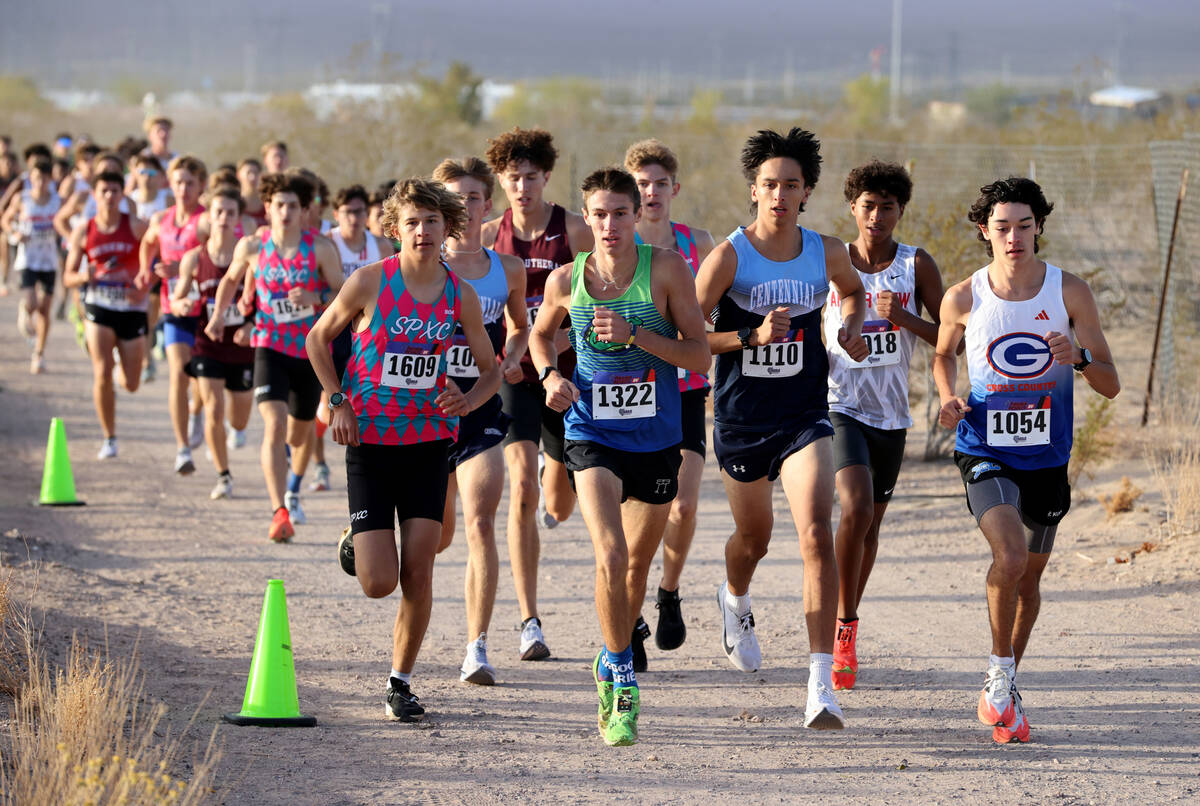 Runners make their way around the course during the Nevada Interscholastic Activities Associati ...