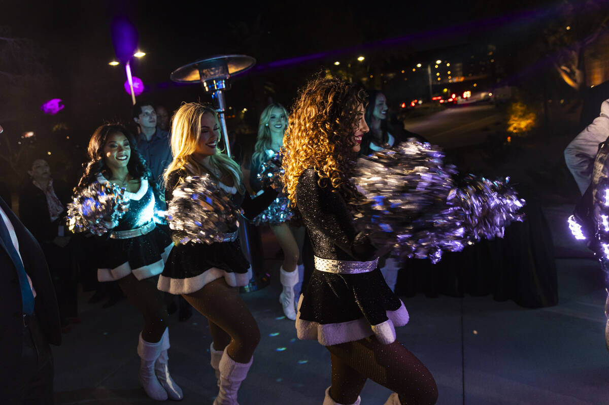 The Raiderettes cheer through the crowd during the grand opening celebration for the M Resort&# ...