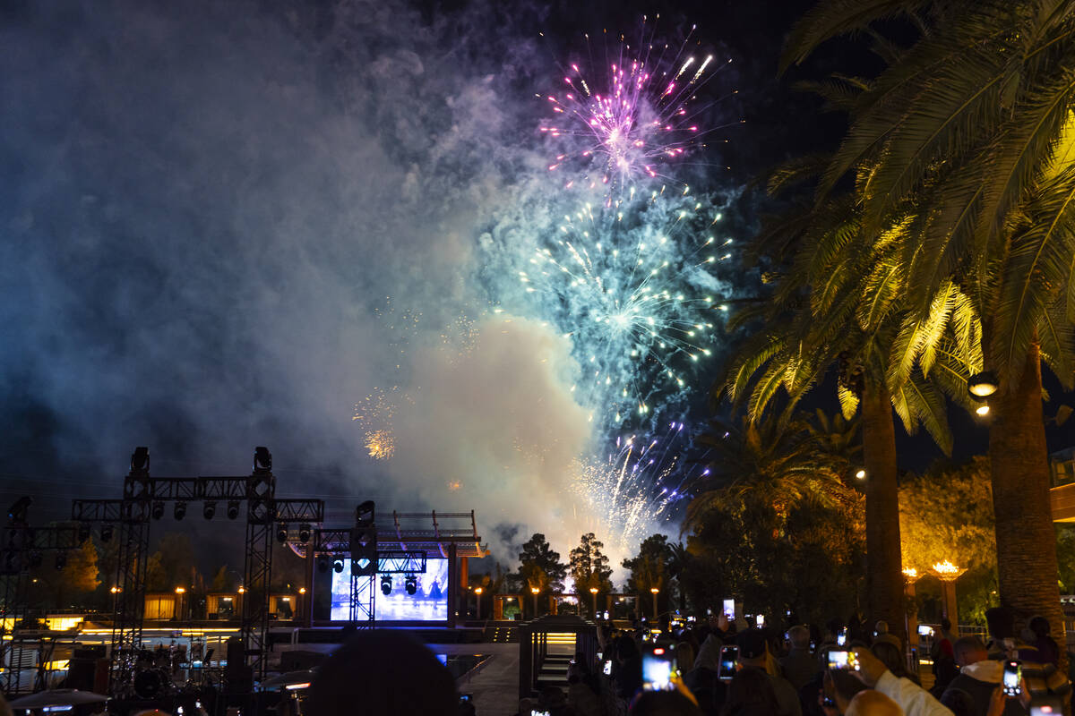 People watch as fireworks go off during the grand opening celebration for the M Resort's n ...