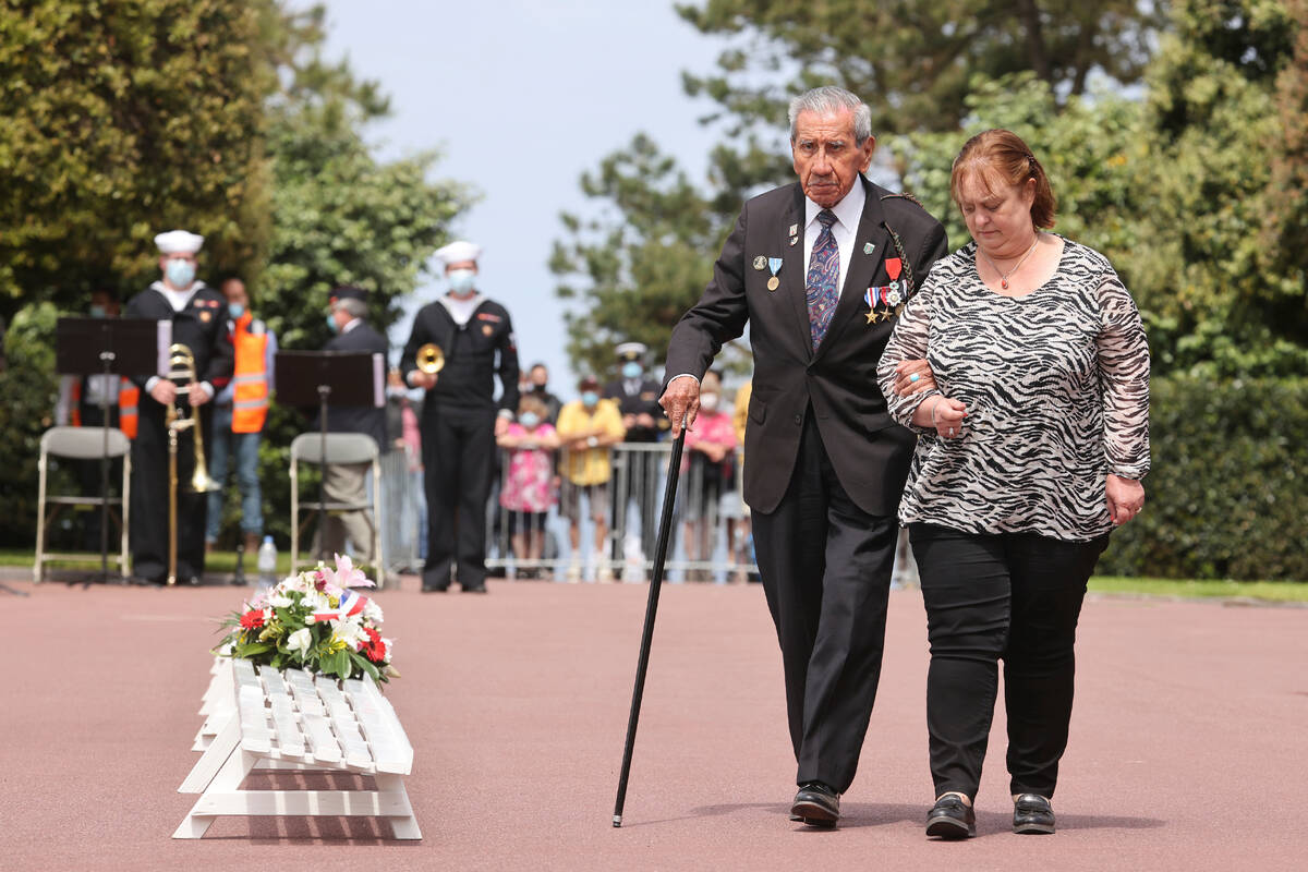 FILE - WWII veteran Charles Shay, 96, pays tribute during a ceremony in the Normandy American C ...