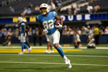 Los Angeles Chargers wide receiver Brenden Rice (82) runs with the ball before an NFL preseason ...