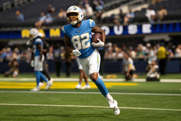 Los Angeles Chargers wide receiver Brenden Rice (82) runs with the ball before an NFL preseason ...