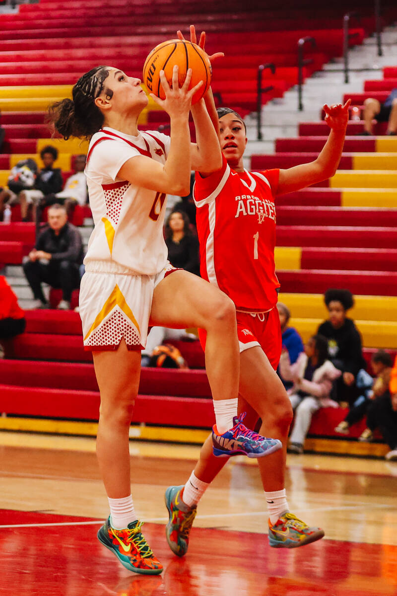 Del Sol guard Angelina Sandoval (0) goes for a layup during a high school basketball game betwe ...