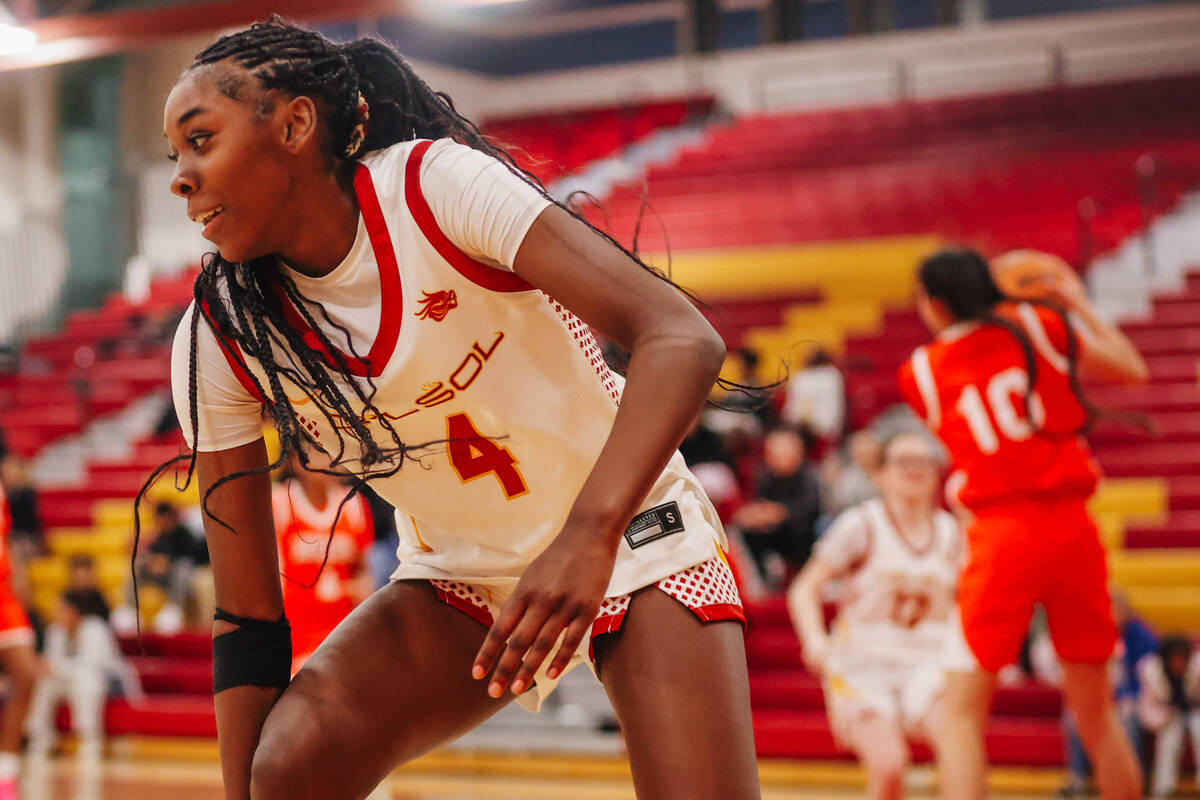 Del Sol guard Ge Ge Pickens regains her balance during a high school basketball game between De ...