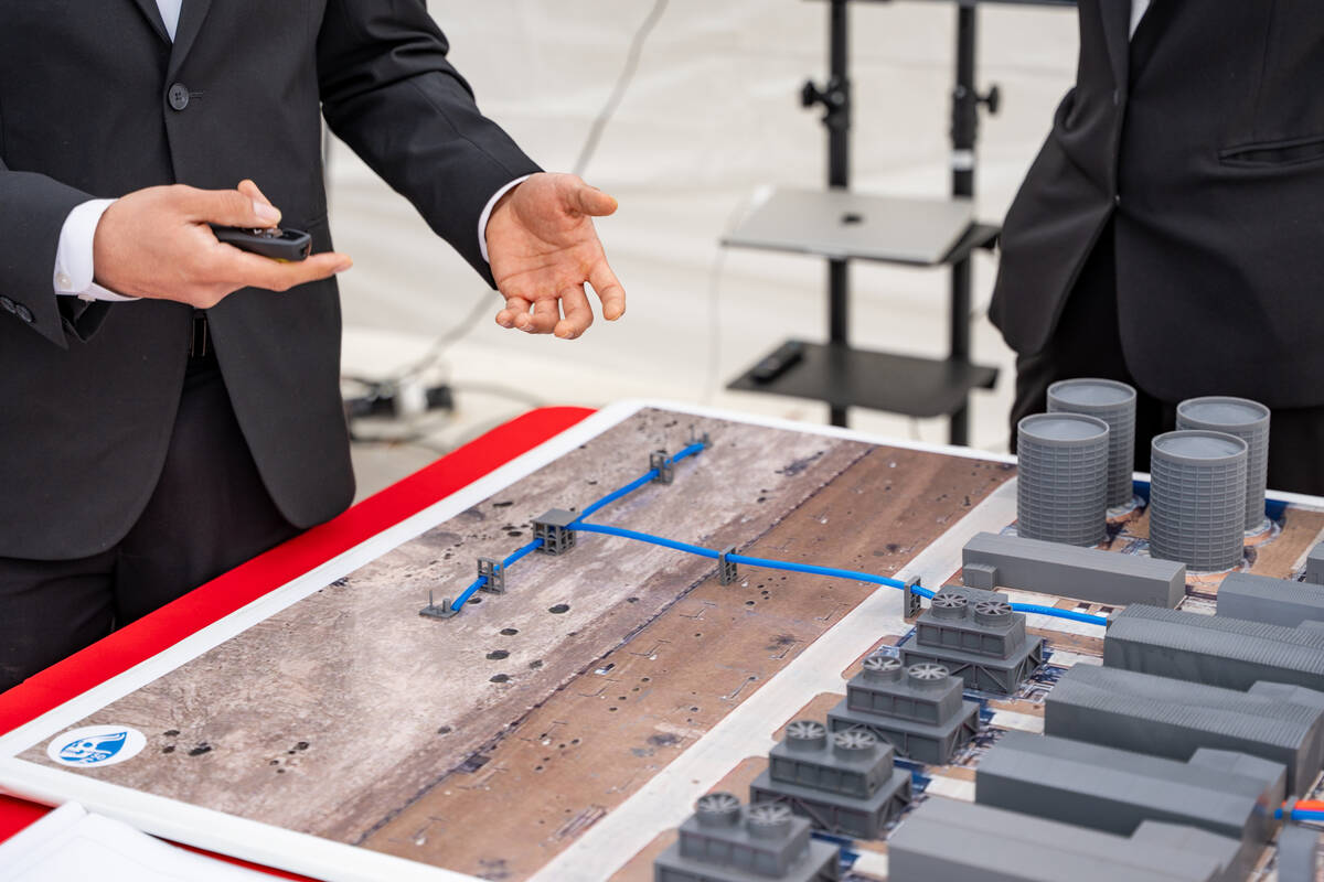 Adrian Montenegro presents his team’s Waste to Watts project to a group of VIPs during the Fr ...