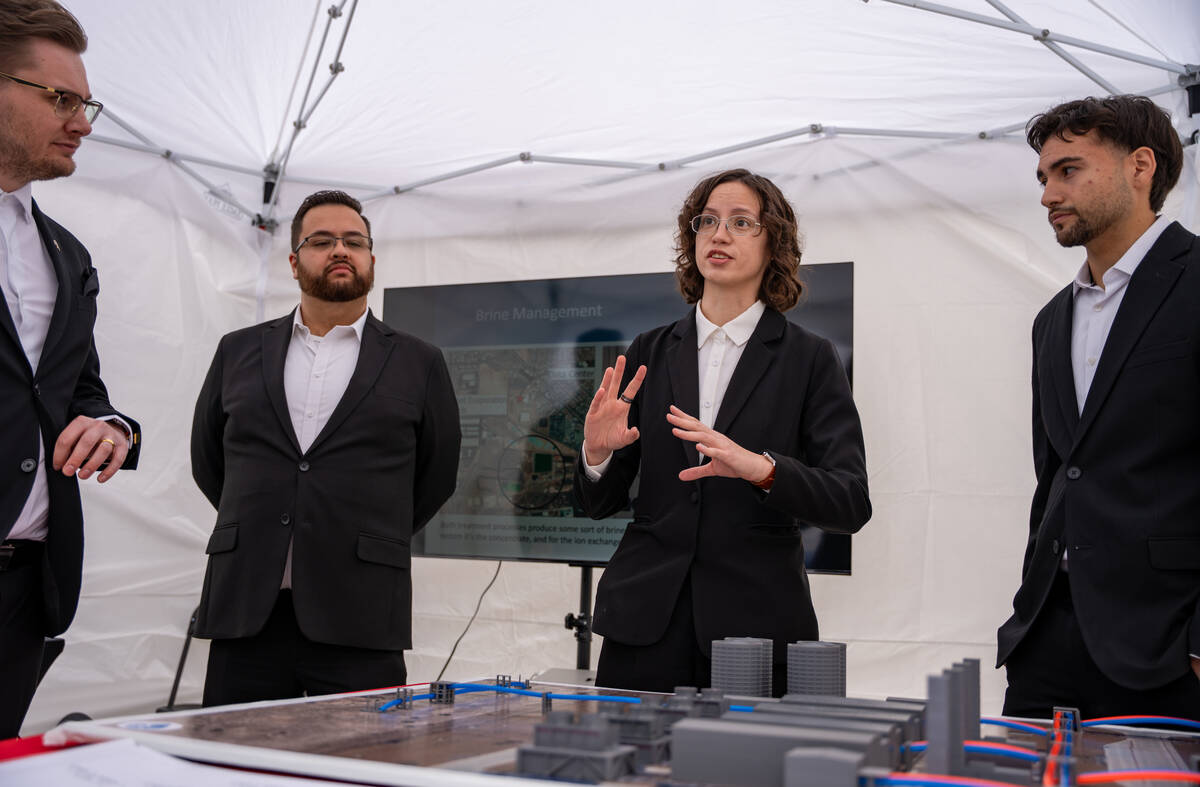 Alyssa Surette presents her team’s Waste to Watts project to a group of VIPs during the Fred ...