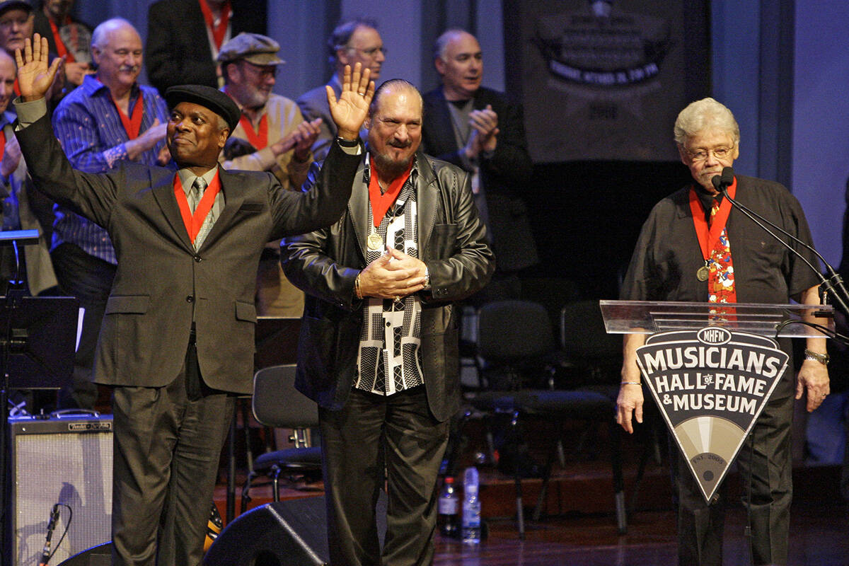 Booker T. Jones, left, Steve Cropper, center, and Donald "Duck" Dunn, right, of the g ...