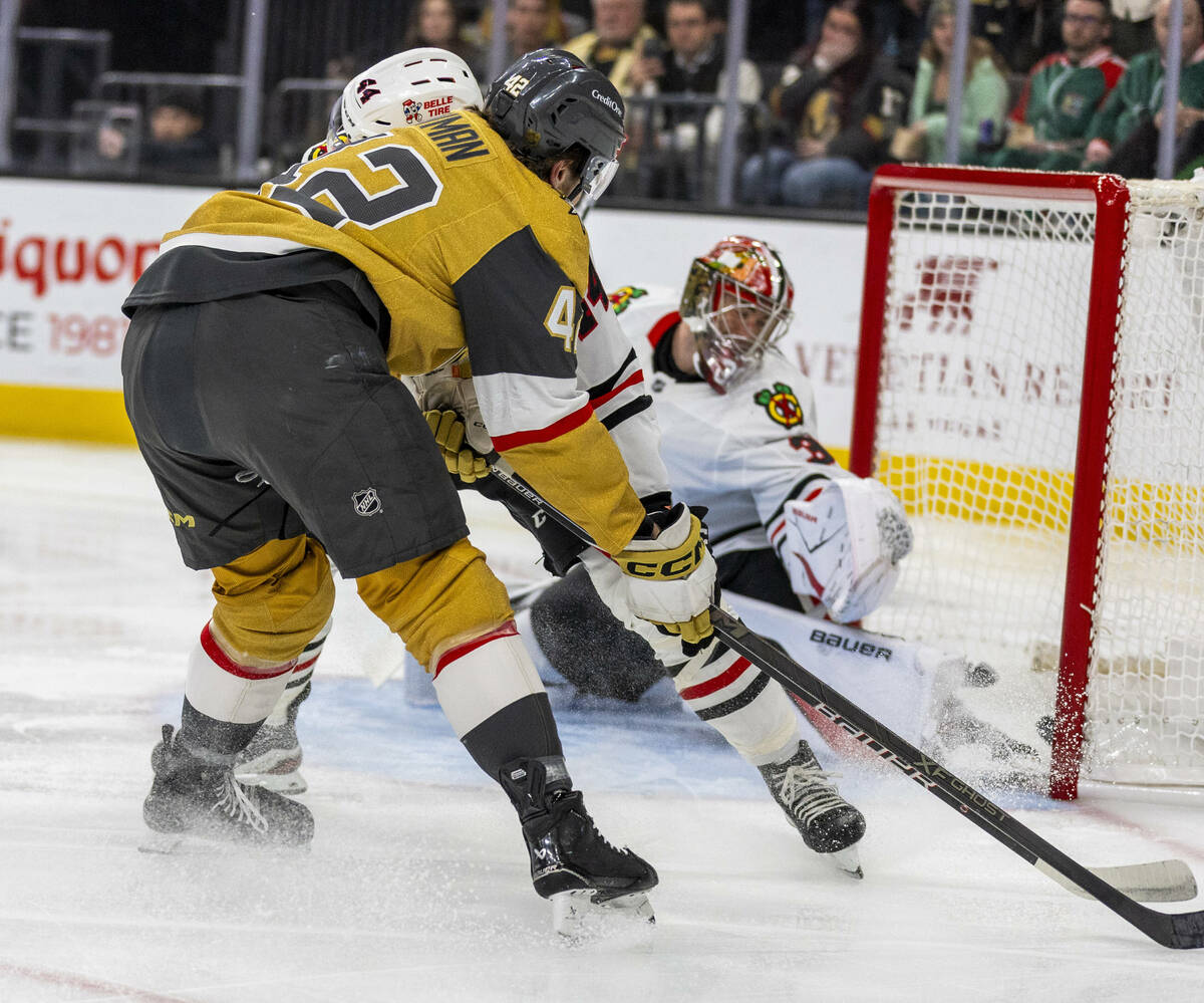 Golden Knights right wing Braeden Bowman (42) sneaks a goal shot past Chicago Blackhawks goalte ...