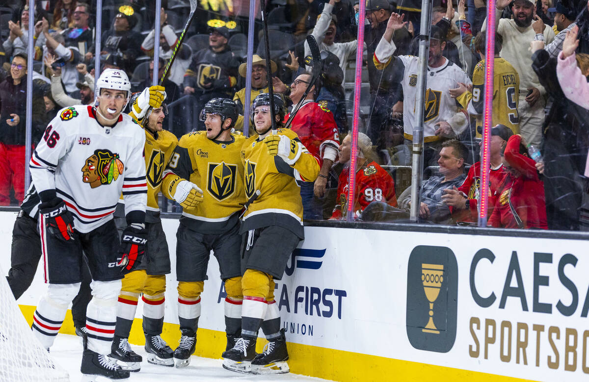 Golden Knights defenseman Noah Hanifin (15)and left wing Ivan Barbashev (49) celebrate a late g ...