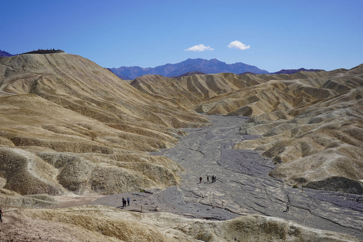 Death Valley visitors meander through Gower Gulch below Zabriskie Point. (Natalie Burt)