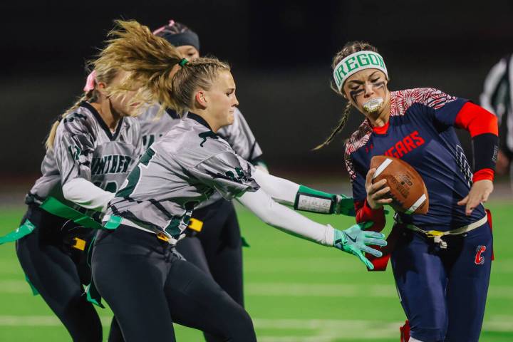 Coronado quarterback Bailey Goldberg gets her flags pulled during a high school flag football g ...