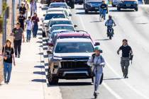 Students ride electric scooters, skateboards and e-dirt bikes along Coronado Center Drive from ...