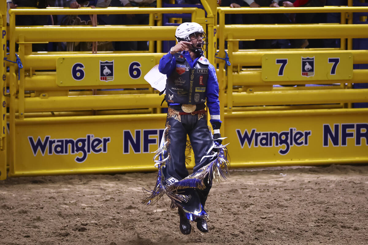 Stetson Wright celebrates after winning in bull riding during the opening day of the National F ...