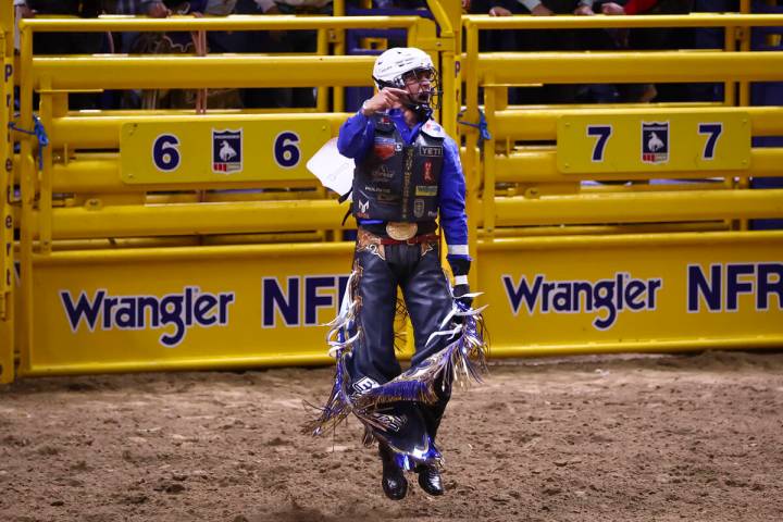 Stetson Wright celebrates after winning in bull riding during the opening day of the National F ...