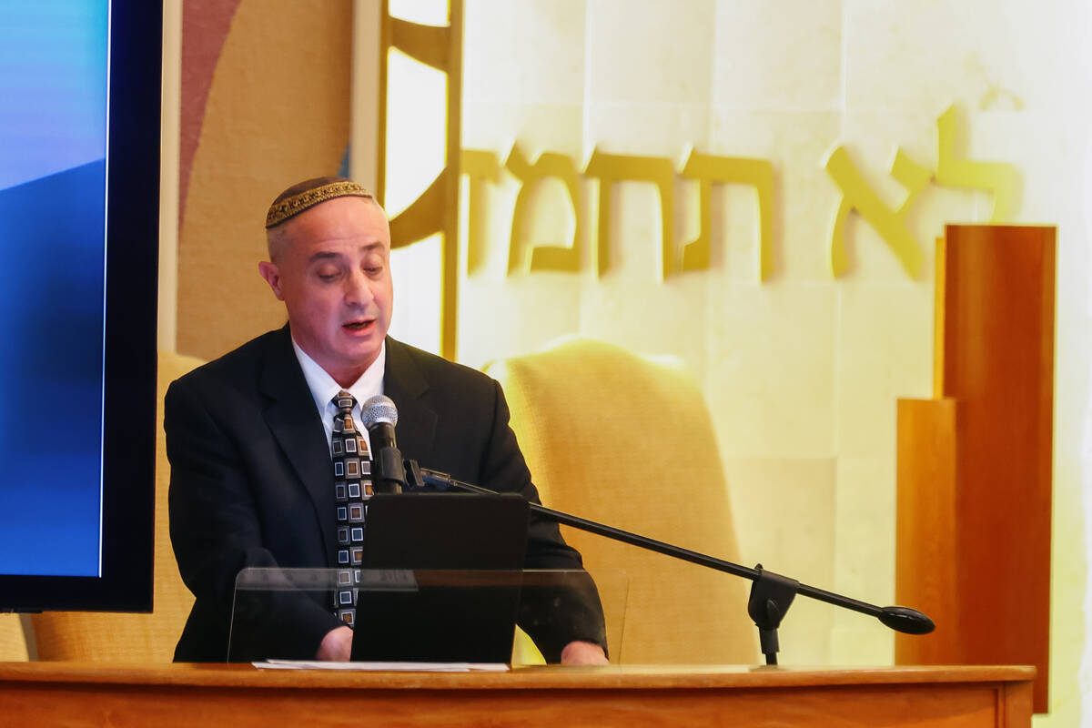 Cantor David Perper sings during a commemoration event for the anniversary of the October 7th a ...