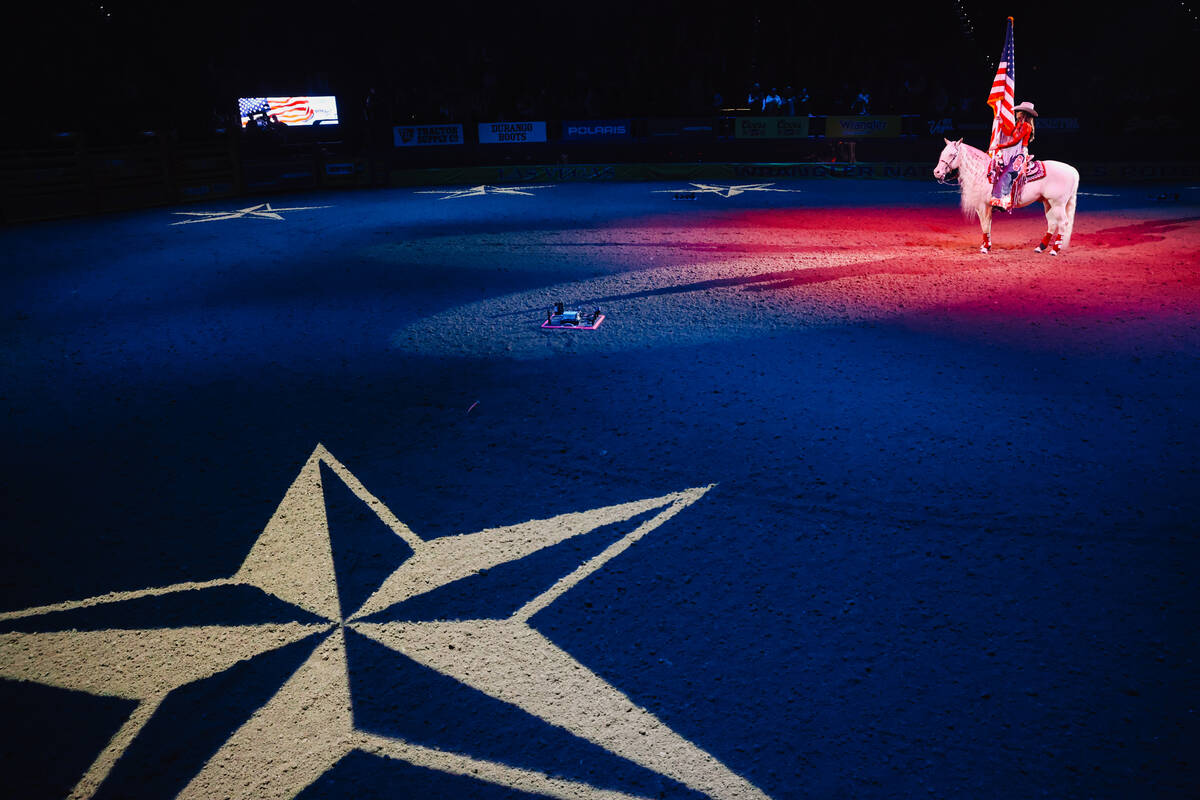 U.S. Secretary of Homeland Security Kristi Noem rides out during the national anthem during day ...