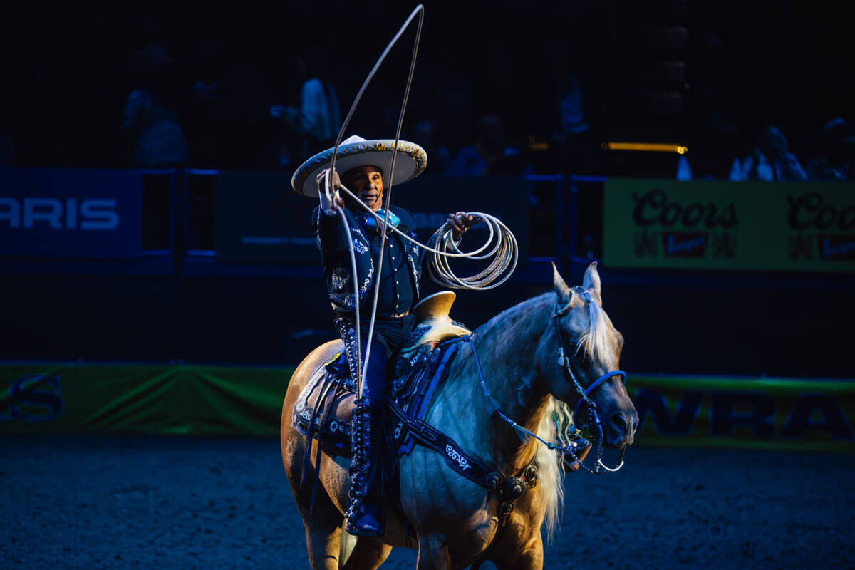 A charro performs during day three of the National Finals Rodeo at the Thomas & Mack Center ...