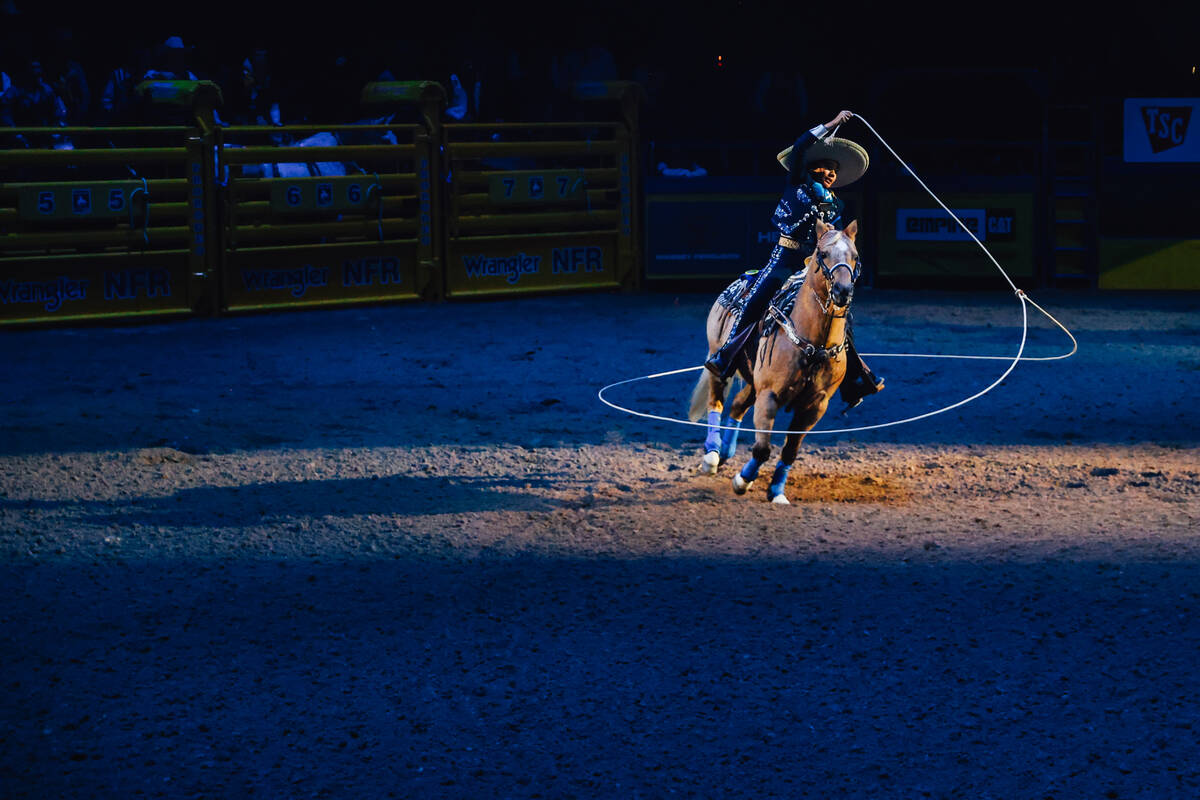 A charro performs during day three of the National Finals Rodeo at the Thomas & Mack Center ...