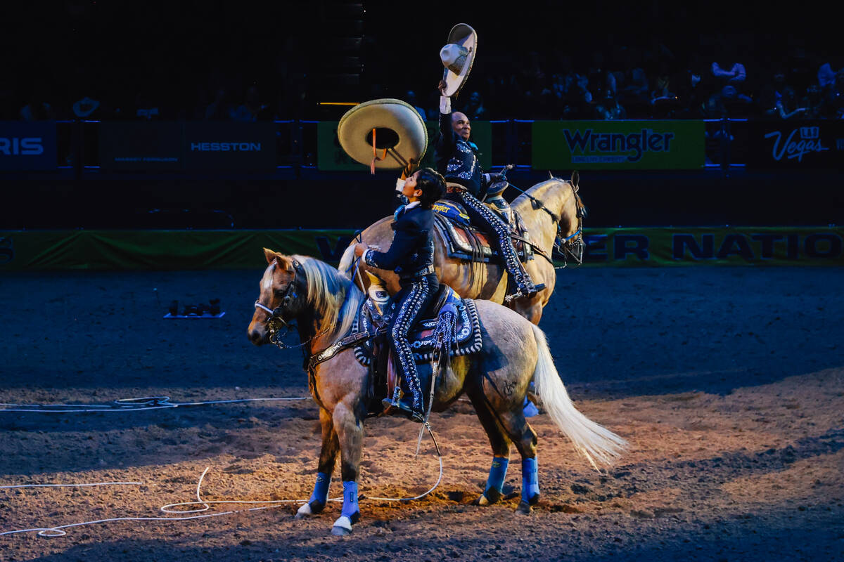 Charros perform during day three of the National Finals Rodeo at the Thomas & Mack Center S ...