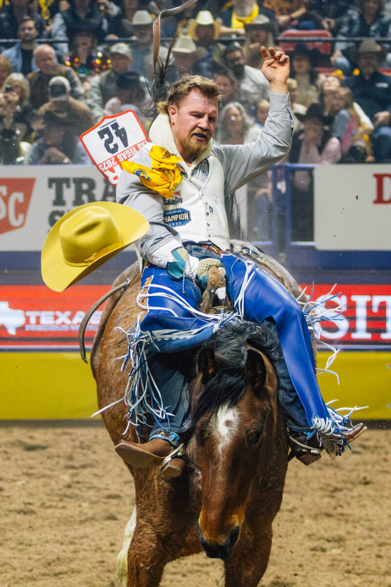 Dean Thompson rides Felton Angus Hot Shot during day three of the National Finals Rodeo at the ...