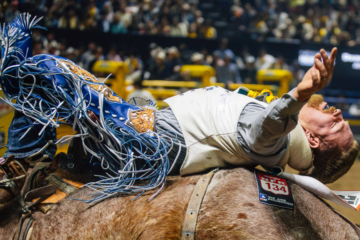 Dean Thompson rides Felton Angus Hot Shot during day three of the National Finals Rodeo at the ...