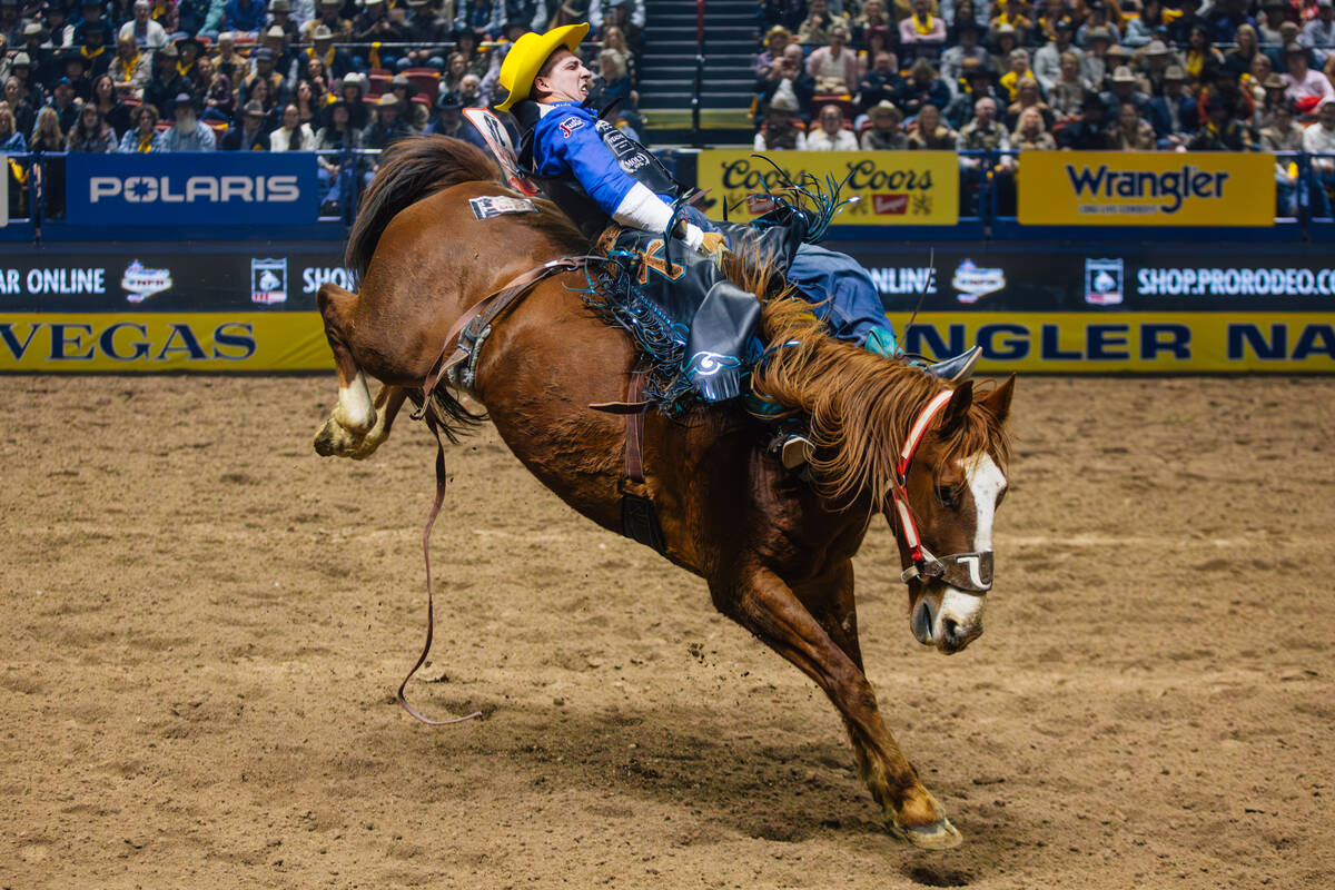Jess Pope rides Right On Q during day three of the National Finals Rodeo at the Thomas & Ma ...