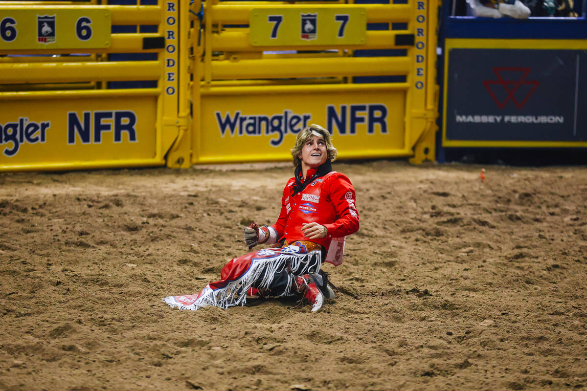 Rocker Steiner reacts after his ride during day three of the National Finals Rodeo at the Thoma ...