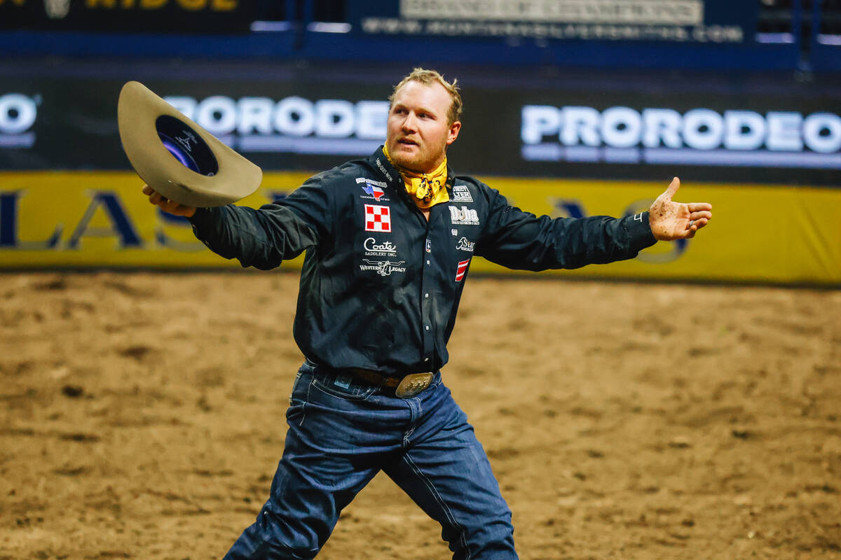 Stetson Jorgensen reacts to his time during steer wrestling on day three of the National Finals ...