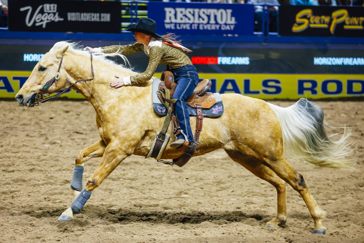 Haylee Gibson-Stillwell rides out of the arena during day three of the National Finals Rodeo at ...