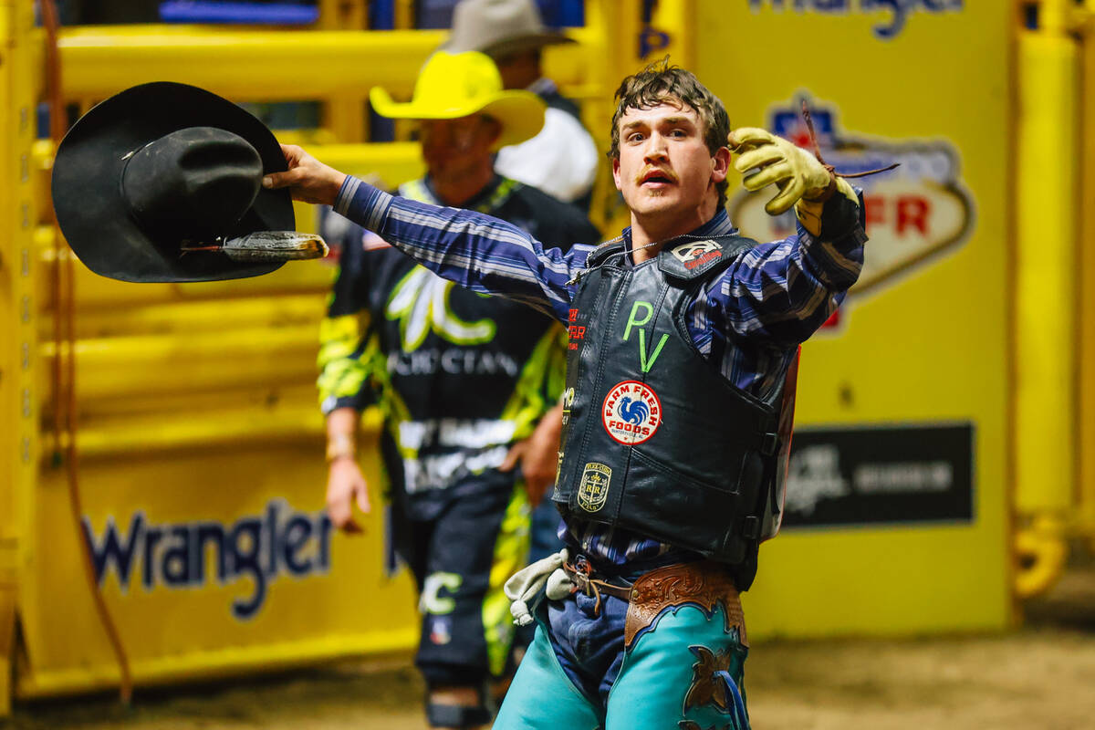 J.R. Stratford celebrates after his ride during day three of the National Finals Rodeo at the T ...