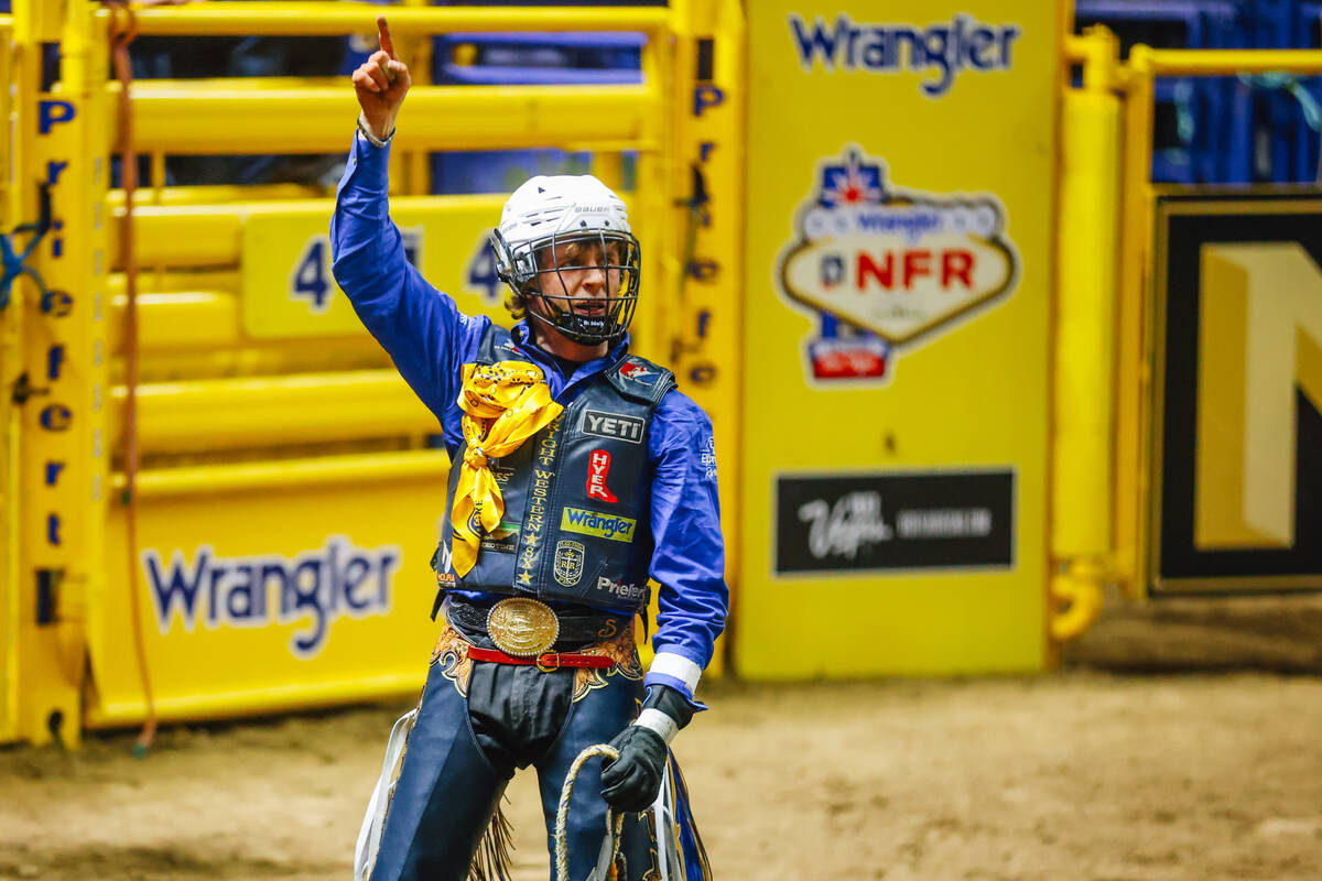 Stetson Wright celebrates his ride during day three of the National Finals Rodeo at the Thomas ...