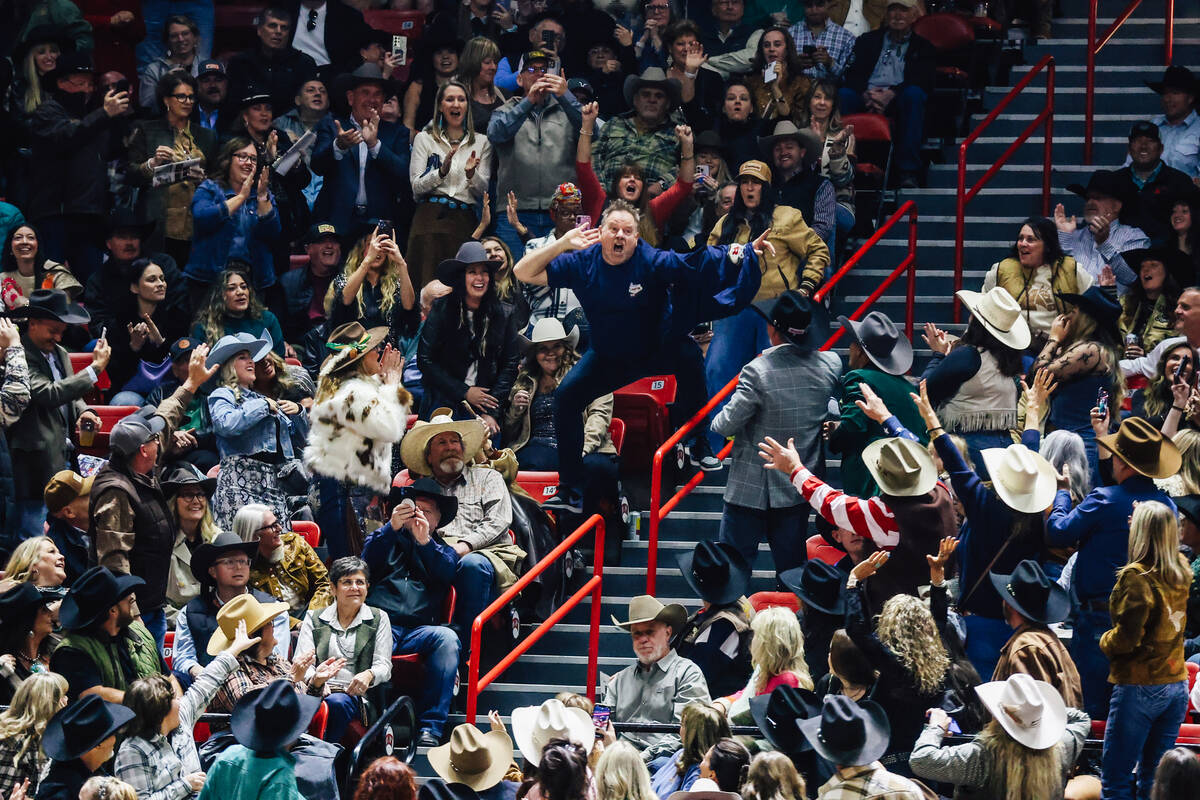 Cameron Hughes cheers and amps up the crowd on day four of the National Finals Rodeo at the Tho ...