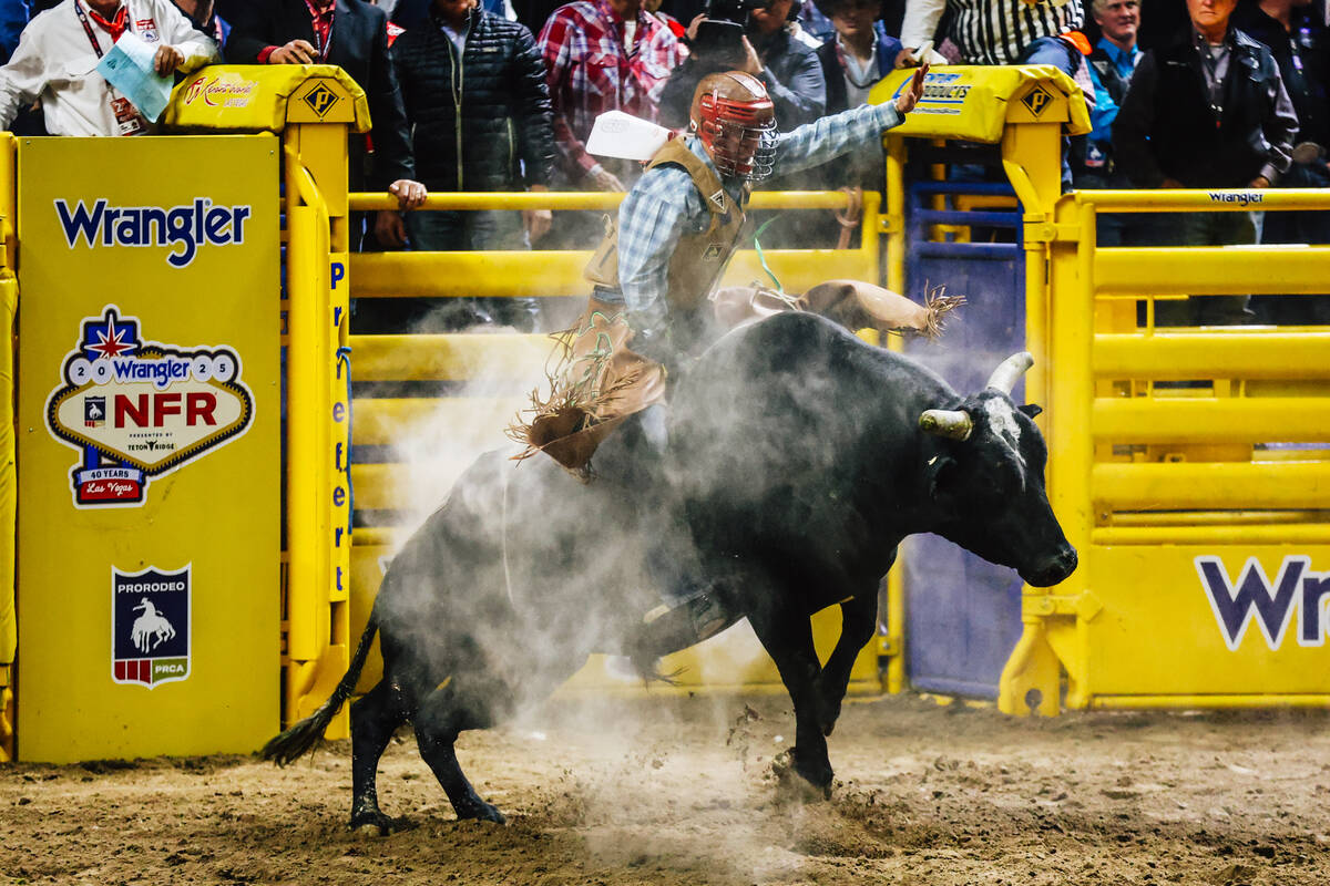 Luke Mackey rides Belly Dump on day four of the National Finals Rodeo at the Thomas & Mack ...