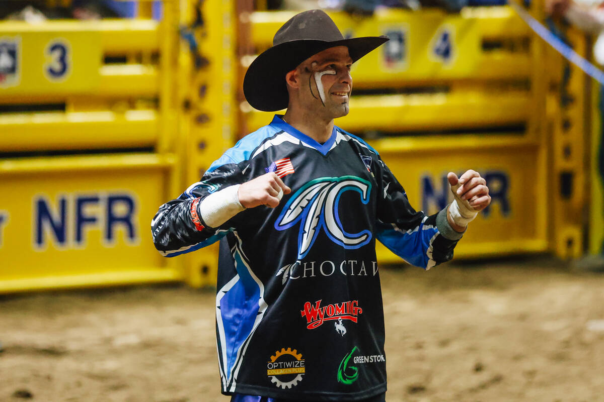 Bull fighter Dusty Tuckness smiles on day four of the National Finals Rodeo at the Thomas & ...