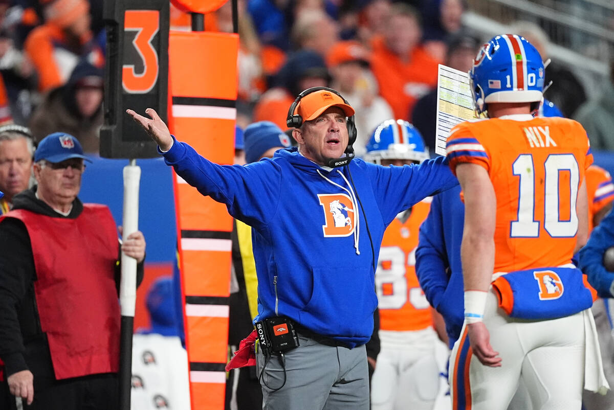 Denver Broncos head coach Sean Payton and quarterback Bo Nix (10) in the second half of an NFL ...