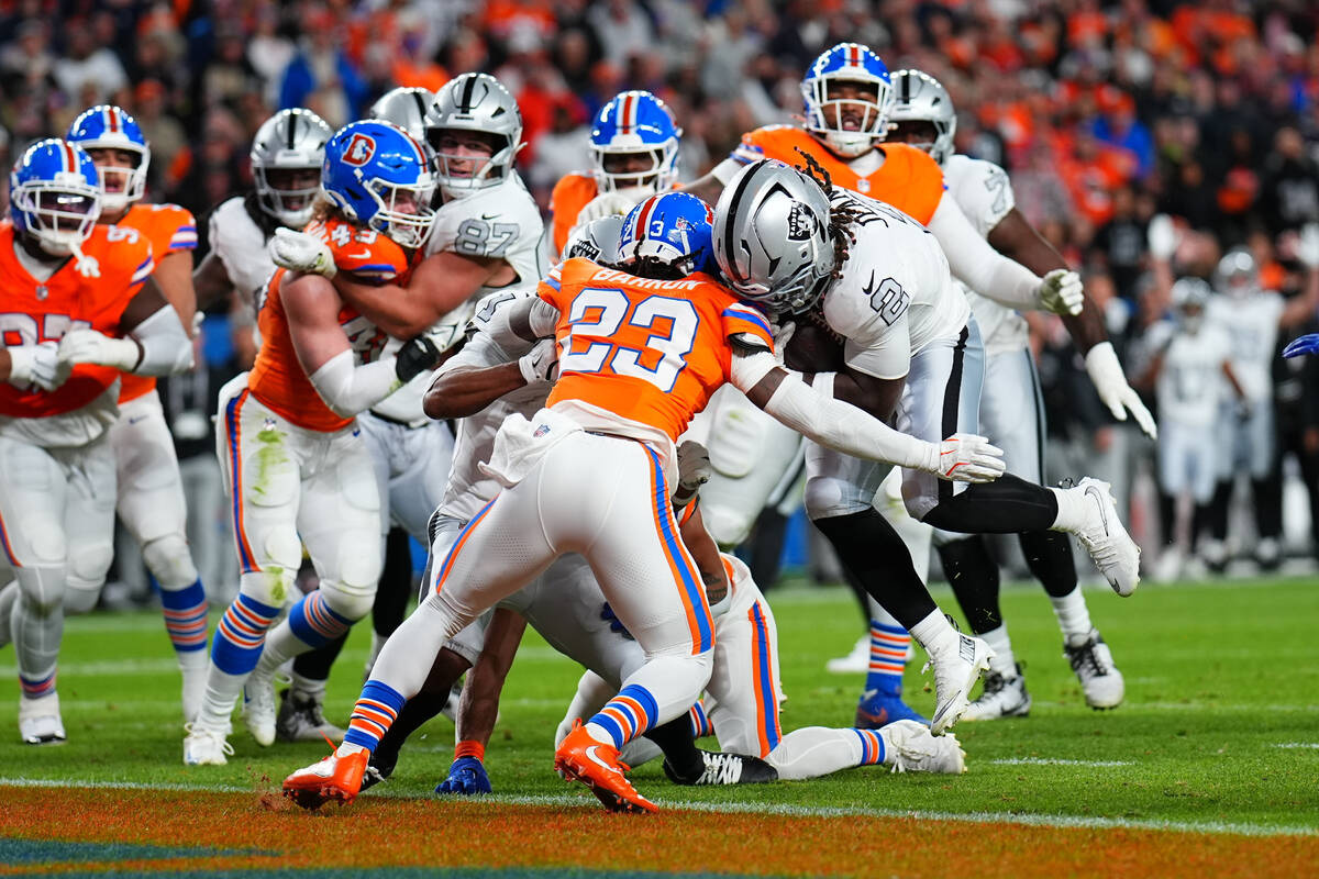 Las Vegas Raiders running back Ashton Jeanty (2) scores a touchdown against Denver Broncos corn ...