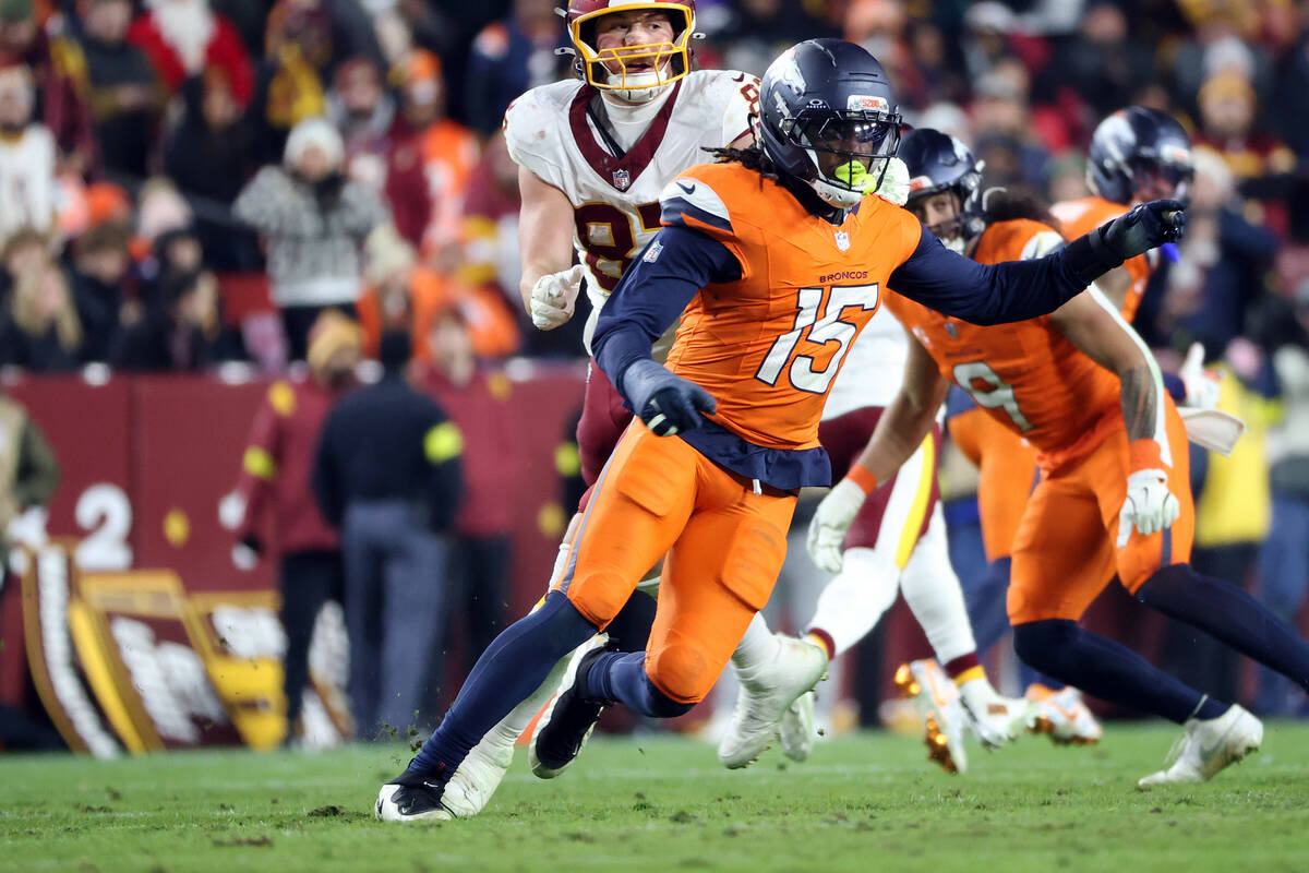 Denver Broncos linebacker Nik Bonitto (15) rushes during an NFL football game against the Washi ...
