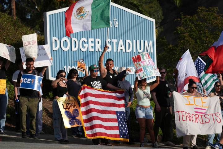 FILE - Demonstrators stage outside Dodger Stadium, June 21, 2025, in Los Angeles. (AP Photo/Dam ...