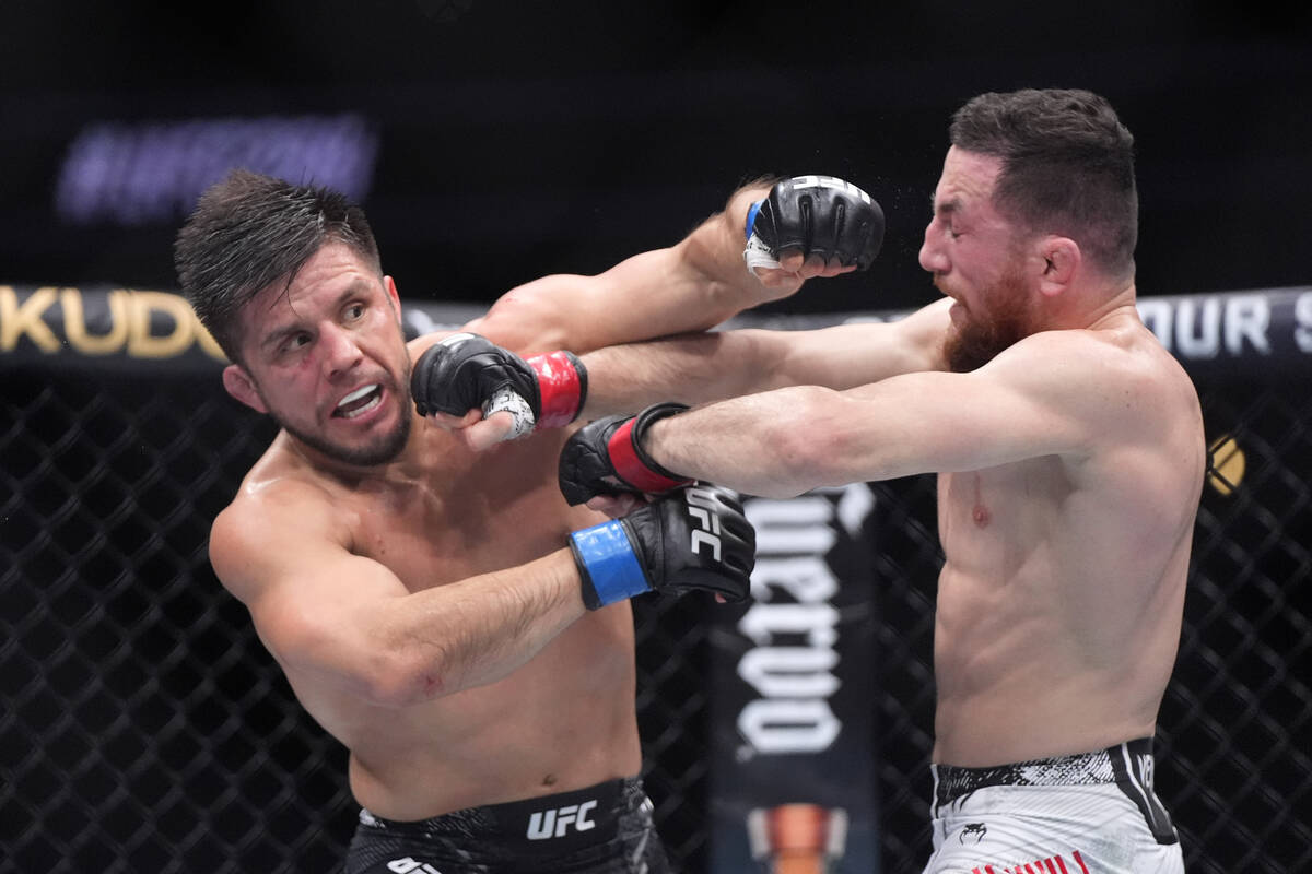 Merab Dvalishvili, right, connects with Henry Cejudo during their bantamweight bout at the UFC ...