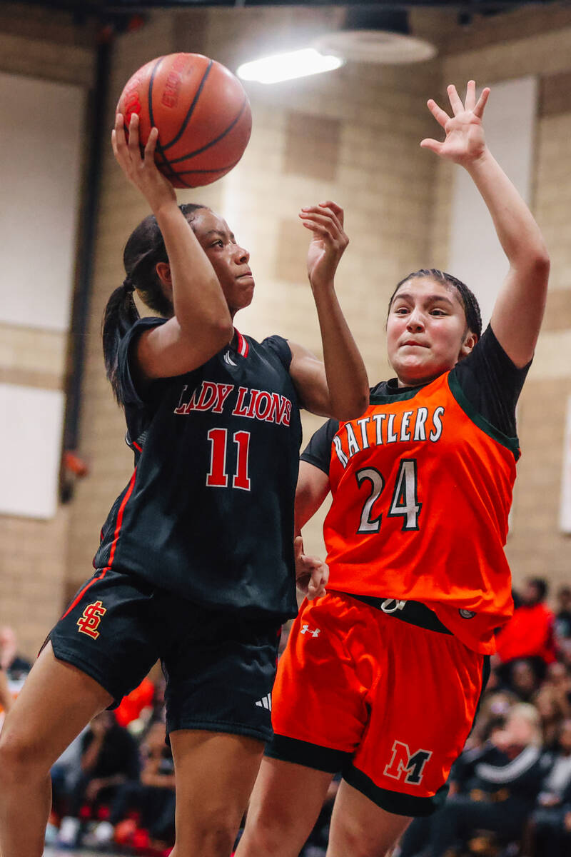 Mojave’s Valeria Martinez-Romero (24) guards Loosee point guard Jordynn Riggins during a ...