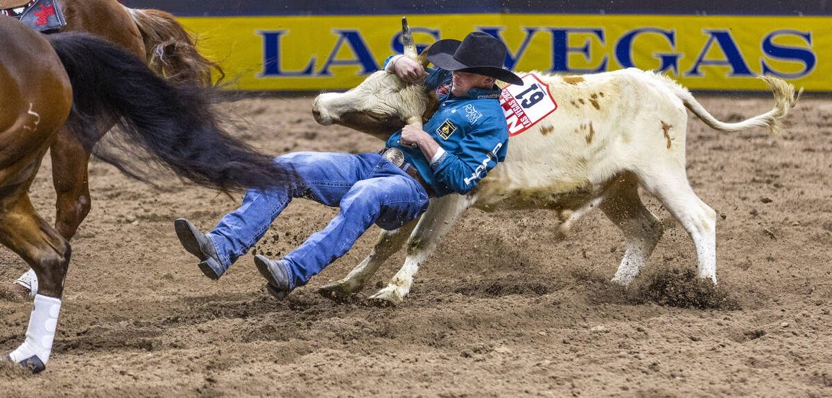 Tucker Allen sets up to take his steer down for a tying win in Steer Wrestling during Day 2 of ...