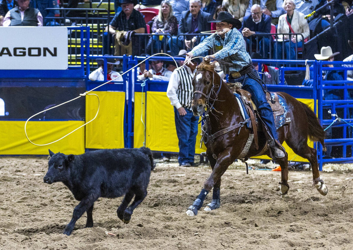 Marty Yates tosses his rope at a calf on the way to a tying win in Tie-Down Roping during Day 2 ...