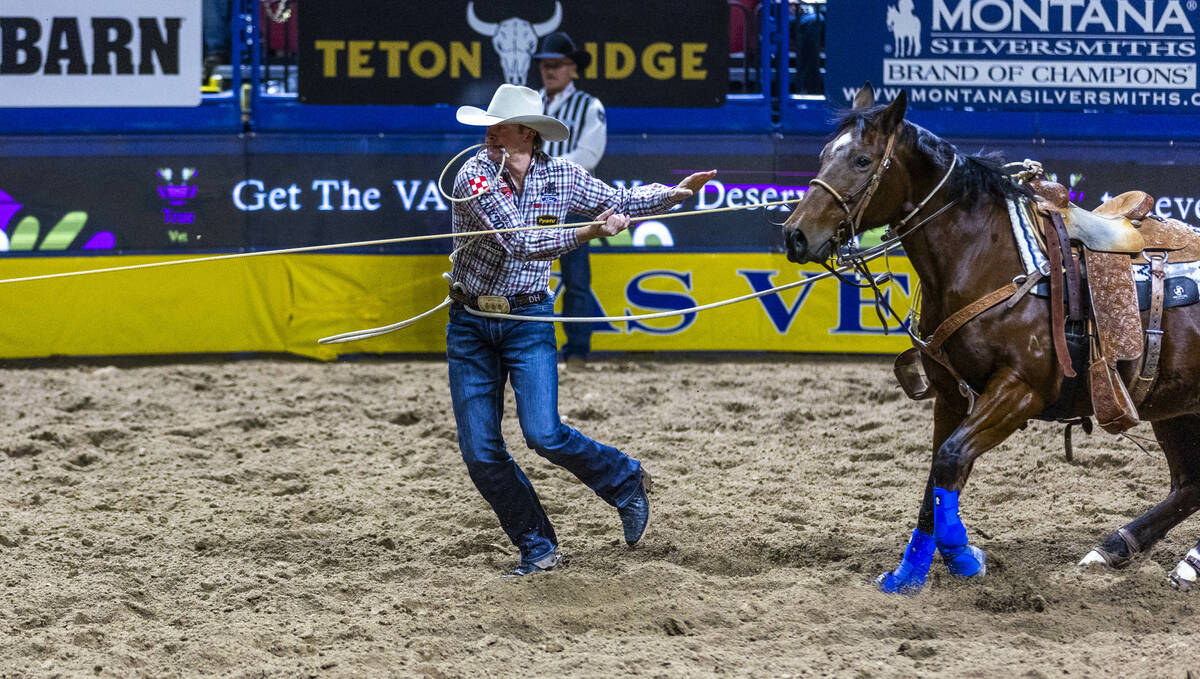 Dylan Hancock leaves his horse to a calf on the way to a tying win in Tie-Down Roping during Da ...