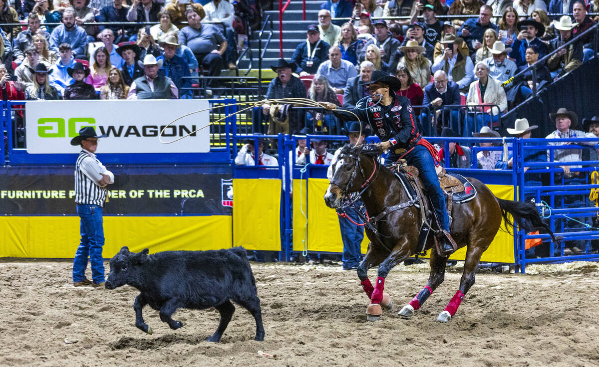 Shad Mayfield tosses a rope to a calf on the way to a tying win in Tie-Down Roping during Day 2 ...